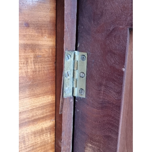 1049 - A pair of 19th century mahogany side cabinets, one enclosing drawers, the other shelves, 96cm wide.... 