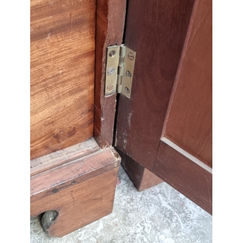 1049 - A pair of 19th century mahogany side cabinets, one enclosing drawers, the other shelves, 96cm wide.... 