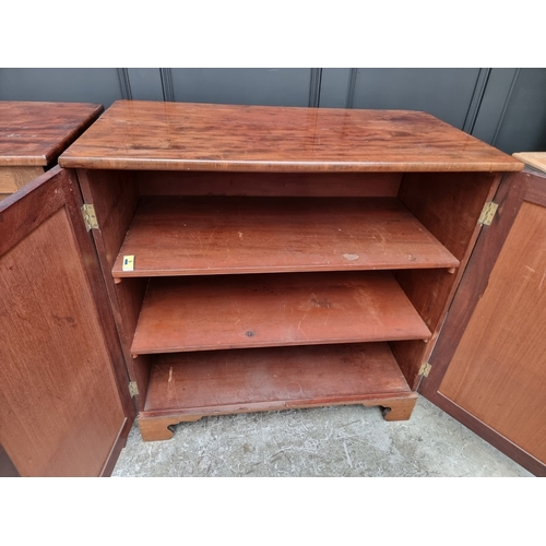 1049 - A pair of 19th century mahogany side cabinets, one enclosing drawers, the other shelves, 96cm wide.... 