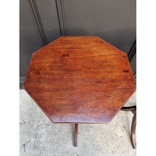 1050 - A pair of mahogany octagonal tripod tables, 40.5cm wide.