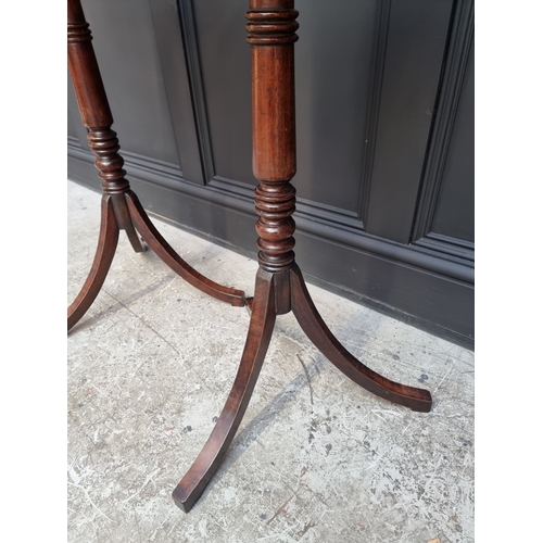 1050 - A pair of mahogany octagonal tripod tables, 40.5cm wide.