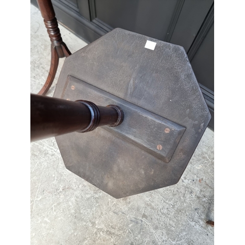 1050 - A pair of mahogany octagonal tripod tables, 40.5cm wide.