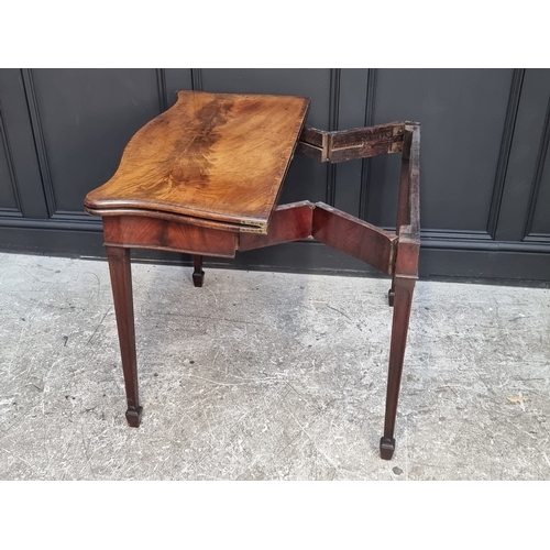 1051 - A George III figured mahogany and crossbanded serpentine concertina card table, 91.5cm wide.... 