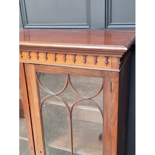 1053 - A large early 20th century mahogany bookcase, 190cm wide.