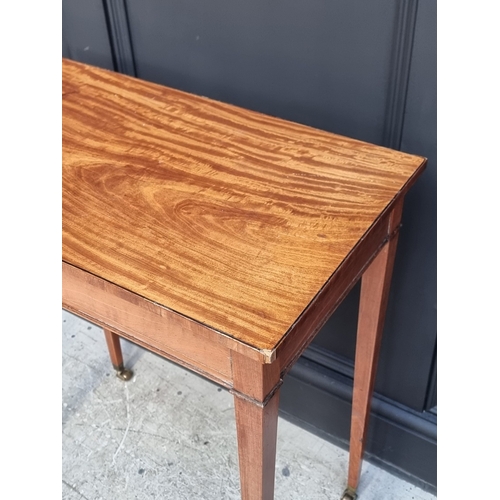 1056 - A small antique satinwood and line inlaid single drawer side table, 62.5cm wide.