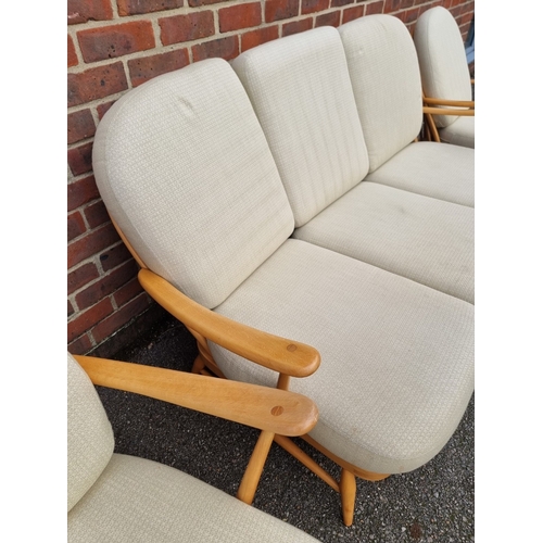 1059 - A vintage Ercol Windsor 203 settee and matching pair of armchairs, with blue stickers. (3)... 