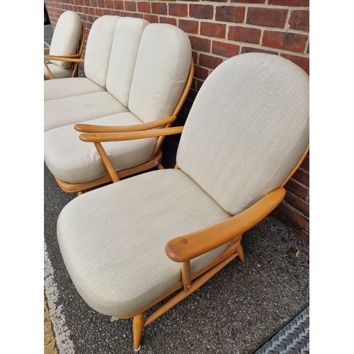 1059 - A vintage Ercol Windsor 203 settee and matching pair of armchairs, with blue stickers. (3)... 