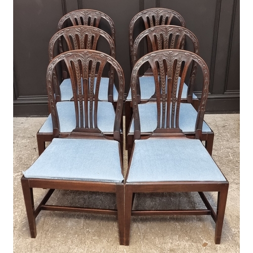 1062 - A set of six George III carved mahogany dining chairs.