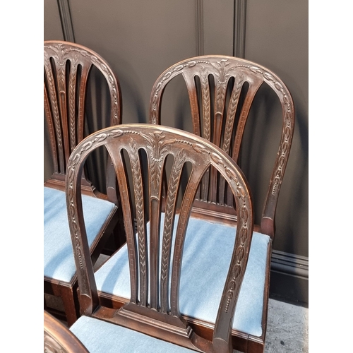 1062 - A set of six George III carved mahogany dining chairs.