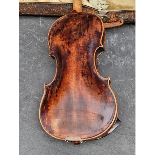 1442 - An antique Continental violin, with 14 1/4in two-piece back, in padded case.