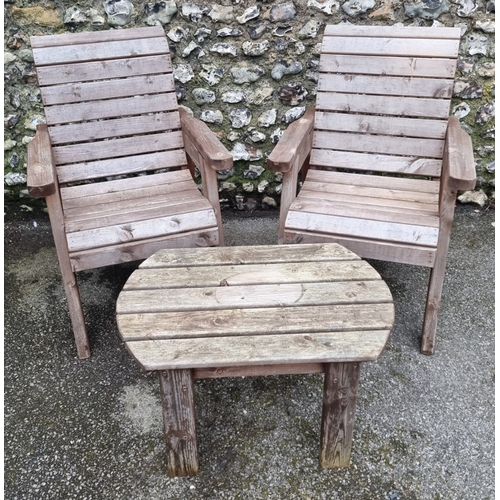 1453 - A pair of pine garden armchairs and matching oval table, 79cm wide.