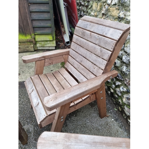 1453 - A pair of pine garden armchairs and matching oval table, 79cm wide.