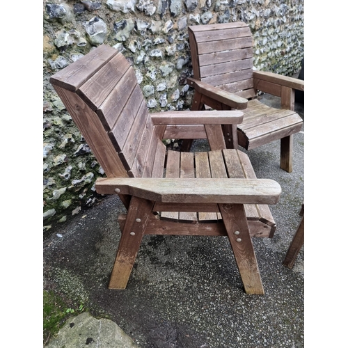 1454 - A pair of pine garden armchairs and matching oval table, 79cm wide.