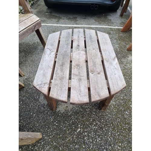 1454 - A pair of pine garden armchairs and matching oval table, 79cm wide.