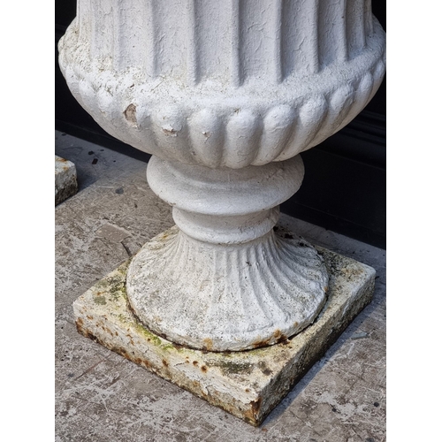 1450 - A large pair of Victorian white painted cast iron Campana urns, 74.5cm high.En suite with the previo... 