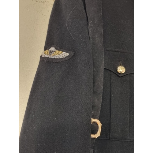 21 - A 1950s British army majors dress blues tunic, with pilots and parachute wings; together with a comm... 