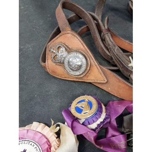 22 - A group of Elizabeth II Metropolitan Police items, comprising: a mounted officers martingale leather... 