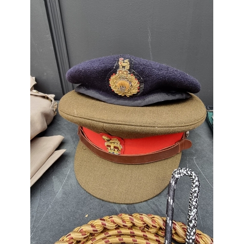 3 - A group of Royal Marines uniform items, to include: a Brigadiers tropical tunic; a peaked cap; a ber... 