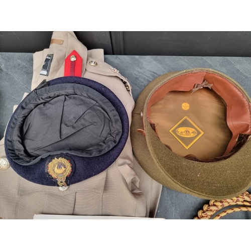 3 - A group of Royal Marines uniform items, to include: a Brigadiers tropical tunic; a peaked cap; a ber... 