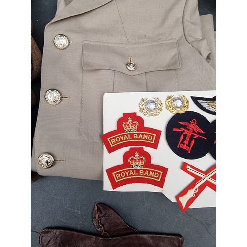 3 - A group of Royal Marines uniform items, to include: a Brigadiers tropical tunic; a peaked cap; a ber... 