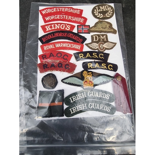 35 - A large selection of assorted WWII cloth patches; together with a quantity of formation signs; photo... 