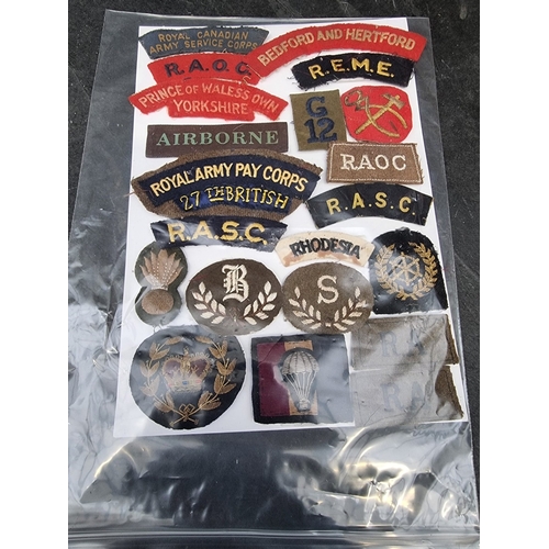 35 - A large selection of assorted WWII cloth patches; together with a quantity of formation signs; photo... 