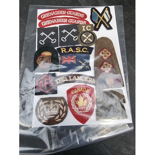 35 - A large selection of assorted WWII cloth patches; together with a quantity of formation signs; photo... 