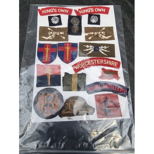 35 - A large selection of assorted WWII cloth patches; together with a quantity of formation signs; photo... 