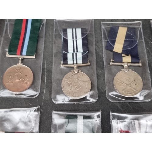 40 - Medals: twenty one WWII and later Indian & Pakistan medals, the Indian examples having various n... 