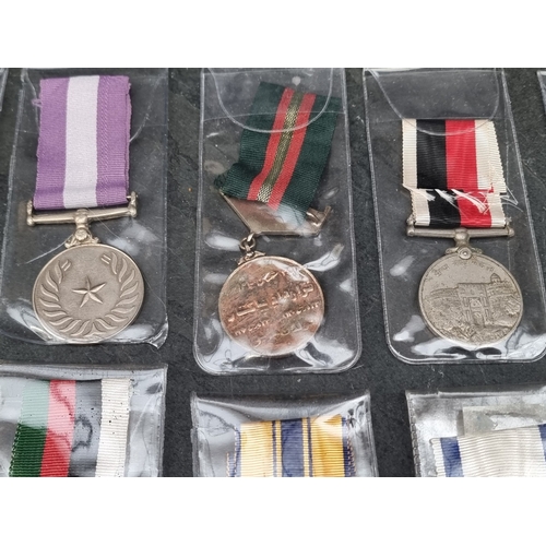 40 - Medals: twenty one WWII and later Indian & Pakistan medals, the Indian examples having various n... 