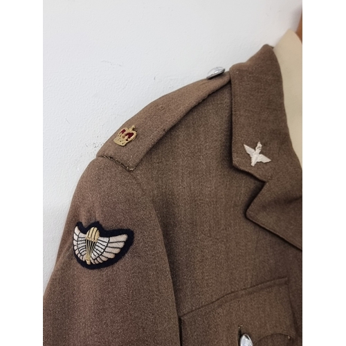 41 - A circa 1963 officers service dress tunic, shirt and tie, with silver plated officer collar badges, ... 