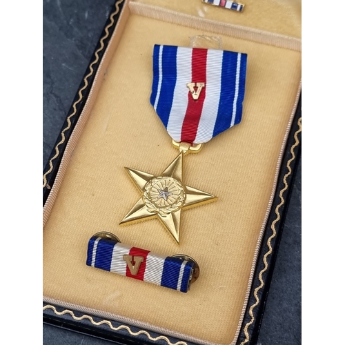 53 - Medals: a WWII US military Silver Star, with ‘V‘ for valour emblem; and a Purple Heart, with tunic m... 