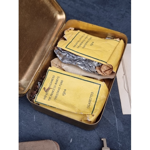 58 - A WWI Princess Mary's Christmas 1914 gift box, with remains of contents and Christmas card; together... 