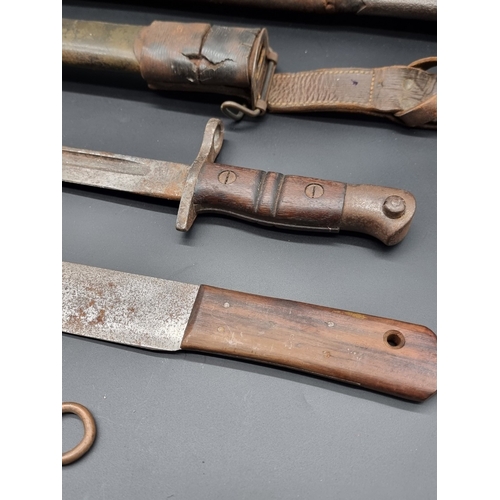 60 - A WWII Home Guard Remington bayonet and scabbard; together with a Royal Navy deck knife; a Jungle ca... 