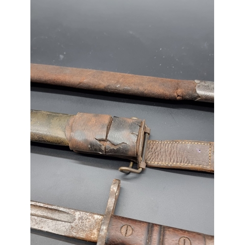 60 - A WWII Home Guard Remington bayonet and scabbard; together with a Royal Navy deck knife; a Jungle ca... 