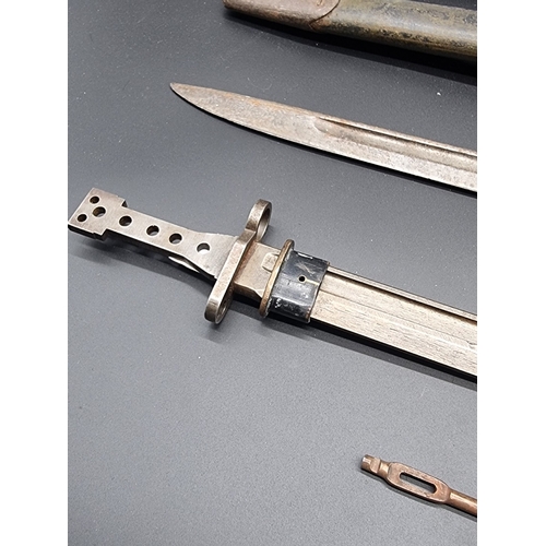 60 - A WWII Home Guard Remington bayonet and scabbard; together with a Royal Navy deck knife; a Jungle ca... 