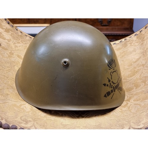 67 - Five various helmets, to include two WWI era French steel examples.