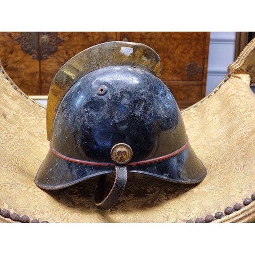 67 - Five various helmets, to include two WWI era French steel examples.