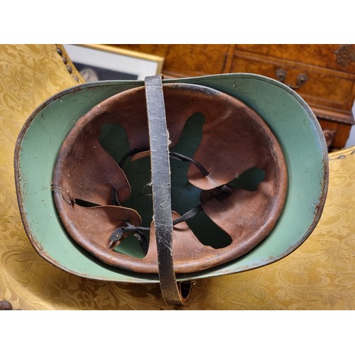 67 - Five various helmets, to include two WWI era French steel examples.