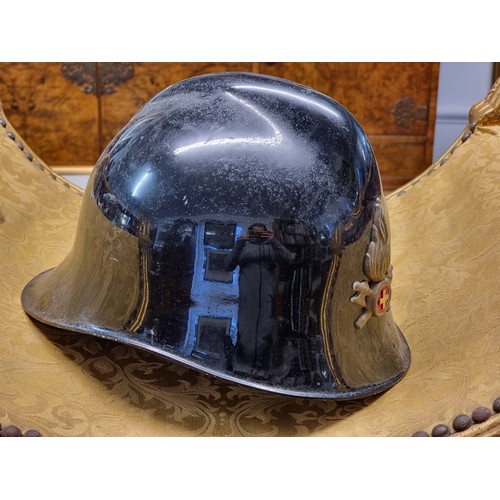 67 - Five various helmets, to include two WWI era French steel examples.