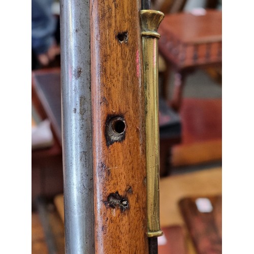 76 - An 18th century flintlock Brown Bess musket, with 101cm barrel and walnut stock, the lock plate stam... 