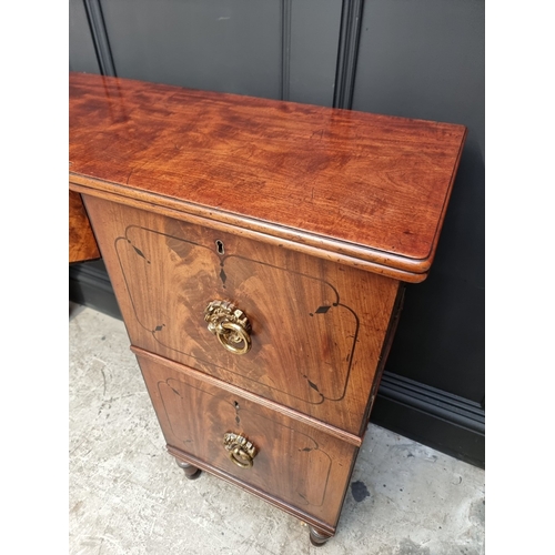 1064 - A Regency mahogany and ebony inlaid bowfront pedestal sideboard, 168cm wide x 50.5cm deep.... 