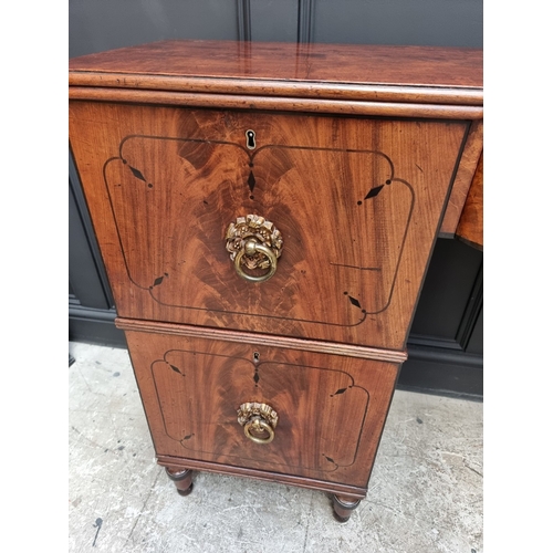 1064 - A Regency mahogany and ebony inlaid bowfront pedestal sideboard, 168cm wide x 50.5cm deep.... 