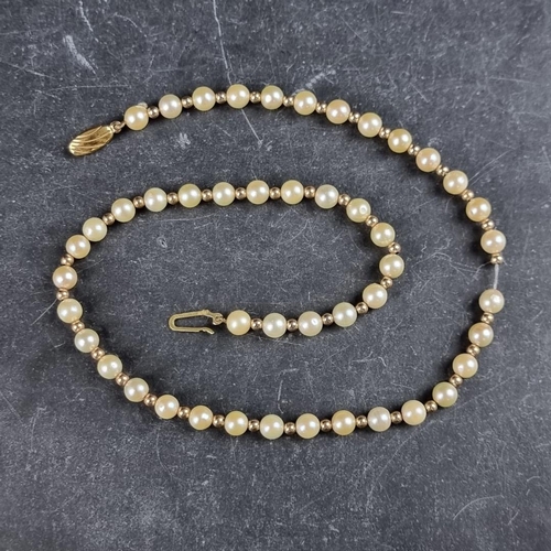 161 - A cultured pearl and gold bead necklace, with 9ct gold clasp, 42cm long.