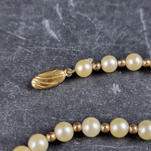 161 - A cultured pearl and gold bead necklace, with 9ct gold clasp, 42cm long.