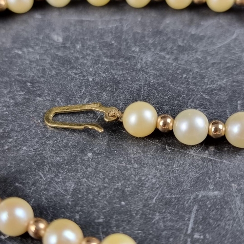 161 - A cultured pearl and gold bead necklace, with 9ct gold clasp, 42cm long.