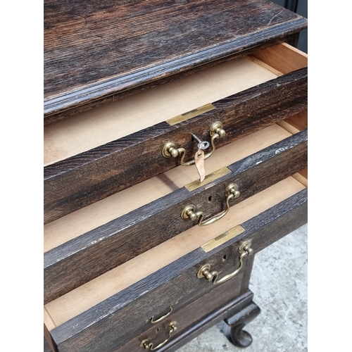 1000 - An early 20th century oak eight drawer chest, 57cm wide.