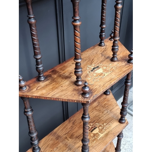 1003 - A Victorian walnut and inlaid four-tier whatnot, 71cm wide.