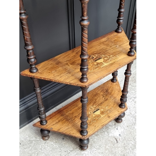 1003 - A Victorian walnut and inlaid four-tier whatnot, 71cm wide.