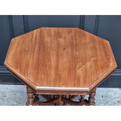 1015 - A circa 1900 walnut octagonal centre table, 74cm wide, (top warped).